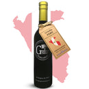 A dark bottle of Georgetown Olive Oil Co. Criolla (PERU) Extra Virgin Olive Oil stands in front of a pink outline of Peru. The label highlights “Fresh Harvest,” “High Polyphenols,” and celebrates this rare Criolla variety, produced by Georgetown Olive Oil Co.