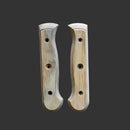 Two Messermeister Custom Driftwood Mod Kit Handles (Medium) by Messermeister, each with curved edges and three holes, are displayed side by side on a dark gray background, highlighting their eco-friendly knife handle design.