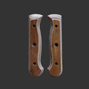 Two Messermeister Custom Russet Mod Kit Handle - Large scales, featuring a contoured shape, smooth edges, and drilled holes, are placed side by side on a dark gray background.