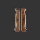 Two Messermeister Custom Russet Mod Kit Handles (Large) lie side by side on a dark background, displaying their three-hole design, distinctive grain, contoured shape, beveled edges, and ergonomic form.