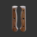 Two Messermeister Custom Russet Mod Kit Handles (Medium) in brown wood, with beveled edges and three holes each, are displayed symmetrically on a dark gray background—ideal for creating a custom knife handle.