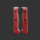 Two Messermeister Custom Terra Mod Kit Handles - Large, with a reddish-brown finish, curved edges, and three screw holes each, are displayed side by side on a dark gray background.