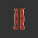 Two Messermeister Custom Terra Mod Kit Handle scales (Medium) with curved edges and screw holes are displayed side by side on a dark background.