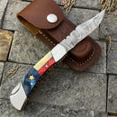 The Texan Knives Damascus Steel Pocket Knife features a 3" blade and a Texas flag-inspired handle; it comes with a brown leather sheath.