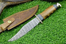 The Texan Knives Western Boulder Colorado Knife features an 11" handmade Damascus steel blade, olive wood handle, and includes a leather sheath.