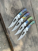 Four Texan Knives Custom Handmade Hunting Knives, each with a 4" patterned Damascus steel blade and colorful resin handle, are arranged side by side on a rustic wooden surface.