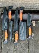 The Texan Knives Damascus Steel Handmade Chef Knife Set with Sharpener features six textured black blades and wood-orange resin handles—displayed with a leather knife roll, it’s the perfect elegant gift for your wife, husband, or Valentine’s Day.