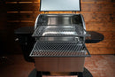 Two metal slide-out racks from the Pimp My Grill Gen2 Slide-Out Rack System installed in an open Camp Chef Woodwind 24 pellet grill.