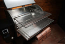 Two Pimp My Grill® Gen2 Slide-Out Rack System - 2 Racks metal grill racks installed in a pellet grill to expand cooking capacity, with a roll of patterned butcher paper resting on the front edge.