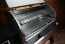 Two stacked slide-out grill racks from the Pimp My Grill® Gen2 Slide-Out Rack System - 2 Racks inside an open stainless steel pellet grill to expand cooking capacity.