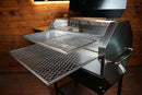 Two stacked Pimp My Grill® Gen2 Slide-Out Rack System - 2 Racks inside an open stainless steel pellet grill, forming a two-level cooking station.