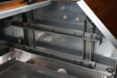 A stainless steel Pimp My Grill® Gen2 Slide-Out Rack System - 2 Racks for the Recteq RT-590 installed inside a metal grill chamber to create a two-level cooking station.