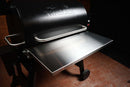Stainless steel Pimp My Grill® Tactical Stainless Folding Front Shelf for Traeger Pro 780 / Ironwood 885 attached to a black pellet grill as a functional smoker shelf upgrade.