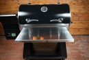 Black Recteq Deck Boss 590 pellet grill featuring a Pimp My Grill® Tactical Stainless Folding Front Shelf that folds down from the front.