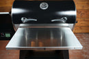 Pimp My Grill® Tactical Stainless Folding Front Shelf for Traeger Pro 34 attached to a black pellet grill.