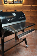 Pimp My Grill® Tactical Stainless Folding Front Shelf for the Recteq Patio Legend 410, featuring a mounted paper holder with a roll of butcher paper for added grill prep space.