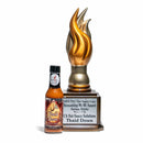 A bottle of California Hot Sauce Solutions J's Small Batch Thai'd Down Hot Sauce stands beside a gold flame-shaped trophy labeled "2024 NYC Hot Sauce Expo Screaming Mi Mi Award Asian Style, California Hot Sauce Solutions, Thai'd Down.