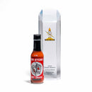 A bottle of California Hot Sauce Solutions CHSS Sir Atcha Hot Sauce, crafted by California Hot Sauce Solutions with fiery Fresno peppers and boldly fermented for flavor, stands next to a tall, clear trophy labeled 2023 Sparky Awards 1st Place Winner Sriracha Style.