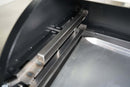 Interior view of a Grilla Grills Silverbac featuring a Pimp My Grill® Gen2 Slide-Out Rack System - 2 Racks with two metal rails mounted to the side wall.