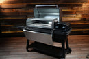Traeger Ironwood XL with its lid open, revealing a Pimp My Grill® Gen2 Slide-Out Rack System with two stainless steel slide-out racks.