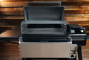 Traeger Ironwood XL with a Pimp My Grill® Gen2 Slide-Out Rack System featuring two metal slide-out wire racks installed inside the cooking chamber.