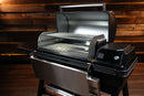 A Traeger Ironwood XL with its lid open, featuring a Pimp My Grill® Gen2 Slide-Out Rack System - 2 Racks.