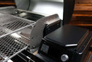 Two Pimp My Grill® Gen2 Slide-Out Rack System - 2 Racks metal slide-out grill racks installed inside a Traeger Ironwood XL, positioned next to the digital control panel.