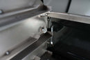 Close-up of the Pimp My Grill® Gen2 Slide-Out Rack System - 2 Racks for the Traeger Ironwood XL installed inside a grill, showing the metal mounting bracket and a small circular fastener.