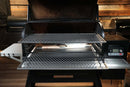 Two Pimp My Grill® Gen2 Slide-Out Rack System - 2 Racks stainless steel wire cooking racks installed inside a Traeger Timberline 1300 pellet grill with the lid open.