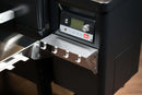 Pimp My Grill Tactical Stainless Folding Front Shelf with four hooks attached below the control panel of a black Traeger Timberline 1300 pellet grill.