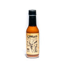 A glass bottle of Calexico Rojo Hot Sauce by California Hot Sauce Solutions with a black cap. The label reads California Hot Sauce Solutions CHSS Calexico Rojo Hot Sauce and features hand-drawn illustrations of a person wearing a hat, stars, and abstract shapes on a beige background, capturing the vibrant spirit of this Southwest-inspired sauce.
