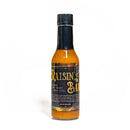 A bottle of California Hot Sauce Solutions J's Small Batch Raisin the Bar Hot Sauce with a black cap, photographed against a white background.