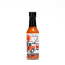 California Hot Sauce Solutions J's Small Batch Fire Truck Hot Sauce by California Hot Sauce Solutions is a 5 fl oz bottle of habanero hot sauce, featuring a fire truck illustration on the label and highlighting “No Sugar - No Preservatives.” Infused with applewood smoked salt for unique flavor, this spicy table sauce stands out on any table.