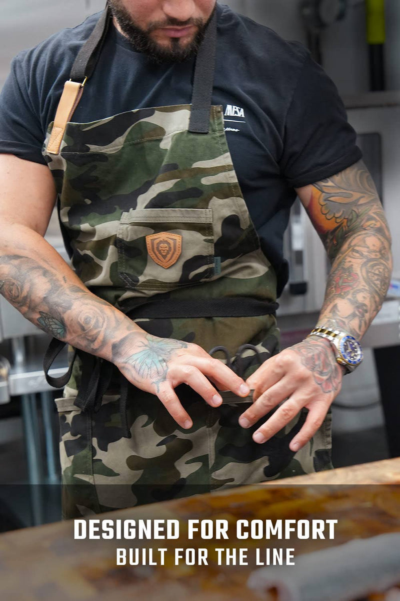 Dalstrong Kitchen Rambo camo apron with adjustable straps and multiple pockets perfect for bbq or grilling at DDR BBQ Supply