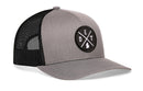 The Haka Hat Detroit Trucker Hat | Gray-Black DET X Snapback features a mesh design, adjustable snapback closure, and a round front patch with “DET” and a mitten icon, honoring Detroit and Michigan.
