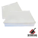 A stack of Butcher BBQ Disposable Cutting Boards 18″ x 24″ (30 Count) features white sheets displaying the red and black Butcher BBQ logo in the bottom right corner, making them perfect as disposable cutting boards for meat trimming or as a reliable BBQ cutting board.