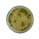 A glass jar of SALTOPIA Infused Sea Salts’ Saltopia Chive Salt: DIVE INTO CHIVES, showing coarse light brown granules and green chive-infused salt pieces, viewed from above on a white background.