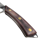 The Spaceman Knives Meteor Series Kitchen Cleaver features a dark wood handle with three brass rivets, resting on white marble. Its stainless steel blade is partially visible, ready for precise meat chopping, with a black cloth in the background.
