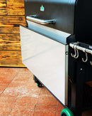 Pimp My Grill Stainless Steel Shelf Extension / Sleeve for Green Mountain Grills Jim Bowie / Peak attached to the side of a pellet grill.