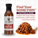 A bottle of B.T. Leigh’s Magical Mop Carolina Vinegar Sauce sits next to shredded meat and a basting brush, with text highlighting its tangy harissa, tomato, and paprika flavor profile.