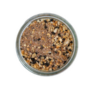 Viewed from above on a white background, Saltopia Everything Bagel Salt by SALTOPIA Infused Sea Salts blends everything bagel seasoning, herbs, black peppercorns, infused sea salt, and spices—a perfect low carb flavor boost.