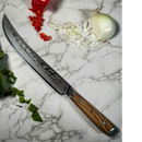 The Spaceman Knives Interstellar Butcher Scimitar Knife, featuring a Damascus finish and wooden handle, rests on a marble surface surrounded by chopped and whole onions, green bell pepper, and red bell pepper.