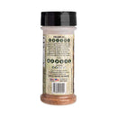 A Hickman's BBQ Natural All Purpose Wild Game Seasoning 4 oz container features social media icons, product details, a barcode, and a small American flag. Black text gives instructions and description on a rustic wood-patterned background.