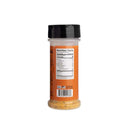 A clear plastic bottle of Hickman's Bovine Bonanza Beef Rub by Hickman's BBQ, with a black lid, is shown from the back displaying the nutrition facts and part of the orange label. The all natural beef seasoning is visible inside.