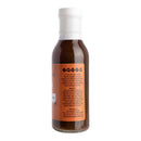 A bottle of Hickman's BBQ Bovine Bonanza Beef Injectable Marinade with Injector features a white cap and an orange label displaying ingredients and product information. The label showcases black and white text, making this marinade from Hickman's BBQ the ideal companion for any meat injector kit or as a flavorful brisket marinade.