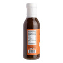 A bottle of Hickman's BBQ Bovine Bonanza Beef Injectable Marinade from Hickman's BBQ is shown from the back, featuring a nutrition facts label and an orange background on the label—perfect for use as a BBQ beef marinade or brisket marinade.