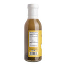 A transparent bottle with a white cap, containing a brown liquid labeled with nutrition facts in black text on a white background. Some sediment settles at the bottom, making Hickman's BBQ Party Fowl Poultry Injectable Marinade with Injector an excellent choice for injecting juicy flavor into chicken and turkey.