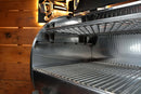 Open grill featuring carbon steel grates and a Pimp My Grill® Gen2 Slide-Out Rack System - 1 Rack installed above the main cooking grate.