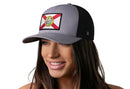 A woman smiles against a white background, wearing the Haka Hat Florida Flag Trucker Hat | Gray-White FL Snapback by Haka Hat.