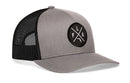The Haka Hat Florida Trucker Hat | Gray-Black FLA X Snapback features a mesh back and a circular front patch with intersecting lines and white "FLA" letters, adding signature Haka Hat style to any outfit.